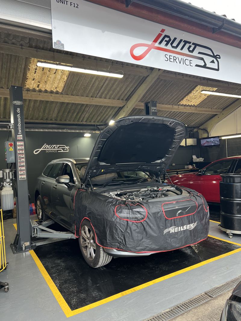 Car on the vehicle lift in the J Auto Service bay