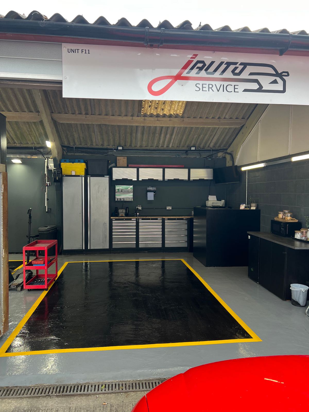 Vehicle service bay inside J Auto Service